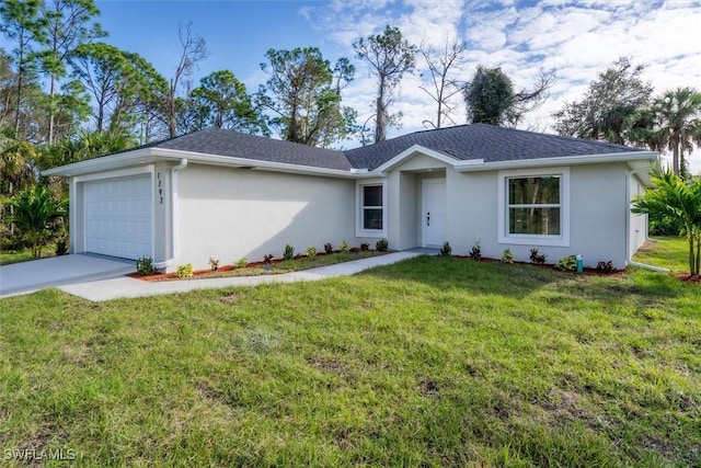 ranch-style home with a front yard and a garage