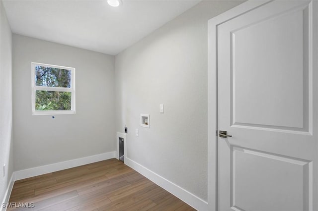 laundry area featuring electric dryer hookup, washer hookup, and hardwood / wood-style flooring