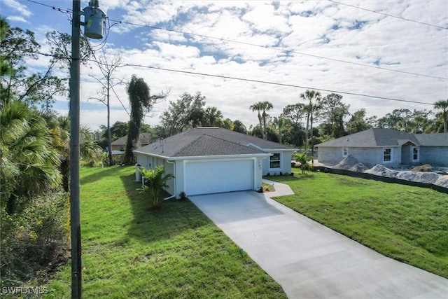 view of front of property featuring a front lawn and a garage