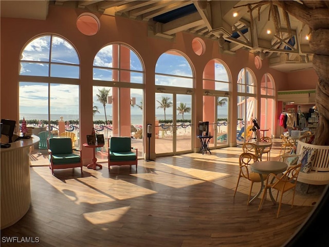 140 Estero Blvd Unit 2101, Fort Myers Beach, FL 33931 - community lobby with beamed ceiling, a high ceiling, and a water view