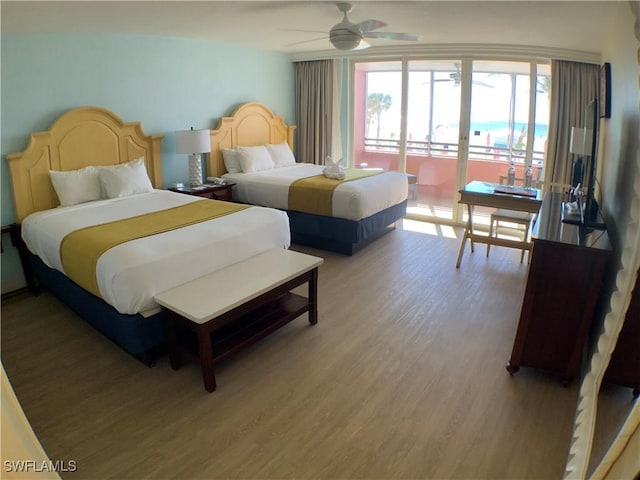 bedroom with access to exterior, ceiling fan, and hardwood / wood-style flooring