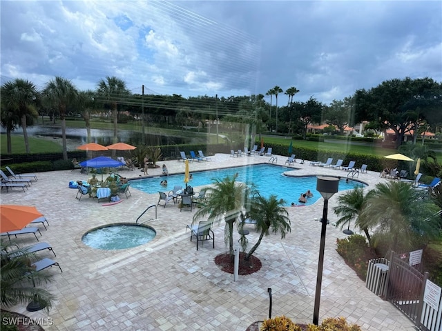 view of pool with a patio area and a community hot tub