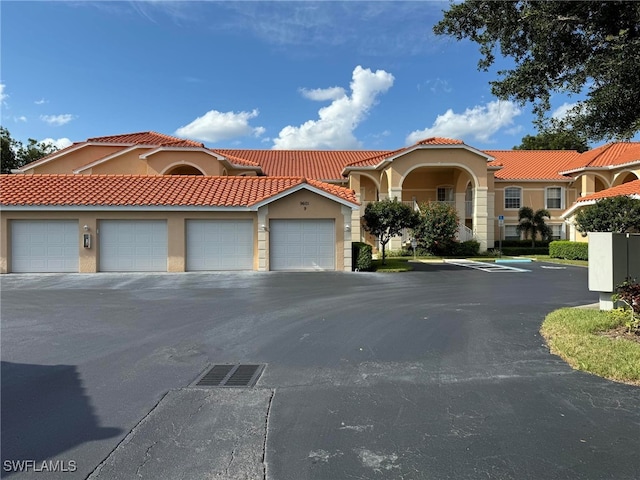 mediterranean / spanish-style house featuring a garage