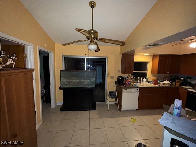 kitchen featuring ceiling fan, dishwasher, sink, vaulted ceiling, and light tile patterned flooring