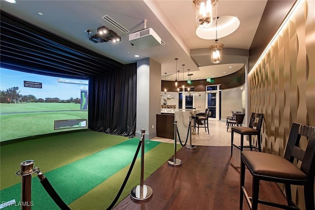 recreation room featuring hardwood / wood-style floors and golf simulator