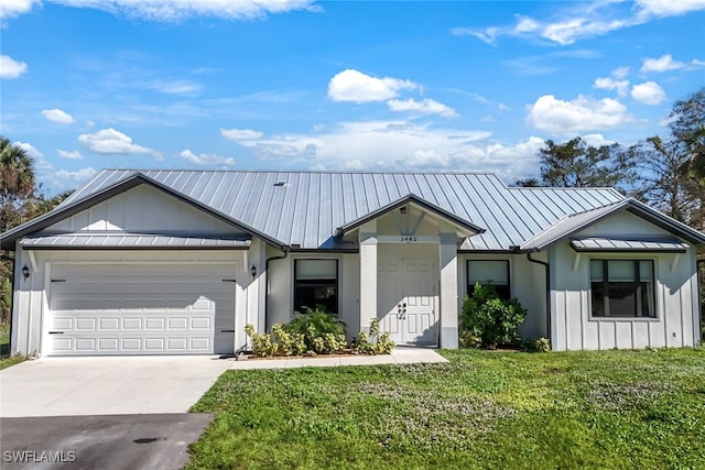 view of front of property featuring concrete driveway, an attached garage, board and batten siding, a standing seam roof, and metal roof