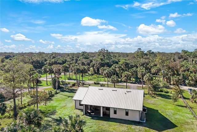 birds eye view of property with a wooded view