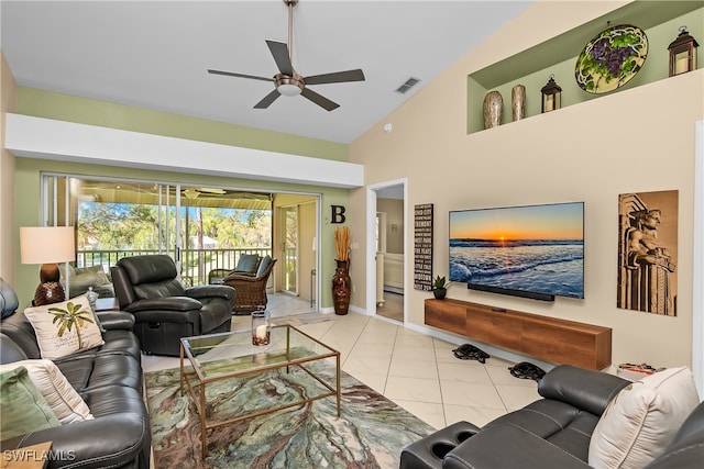 tiled living room with high vaulted ceiling and ceiling fan