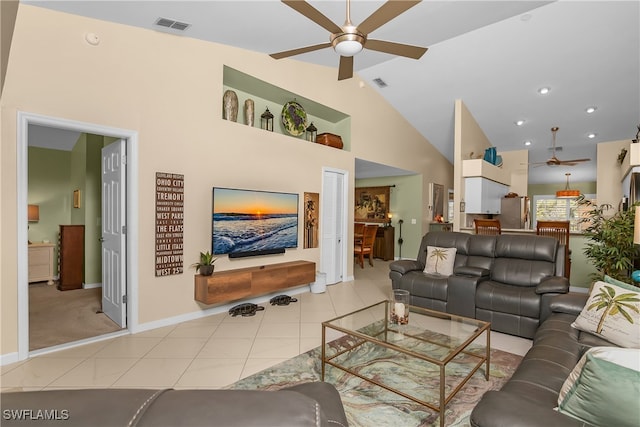 living room with light tile patterned floors, high vaulted ceiling, and ceiling fan