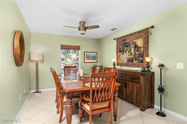 dining area with light tile patterned floors and ceiling fan