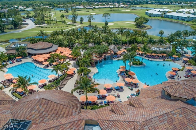 view of swimming pool with a water view