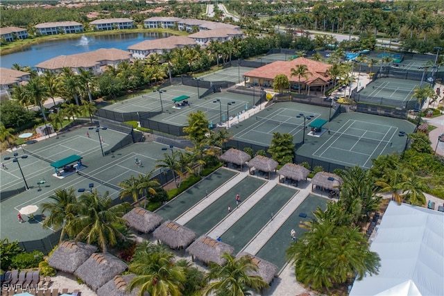 birds eye view of property with a water view