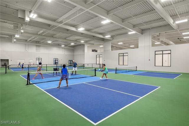 view of tennis court with basketball hoop