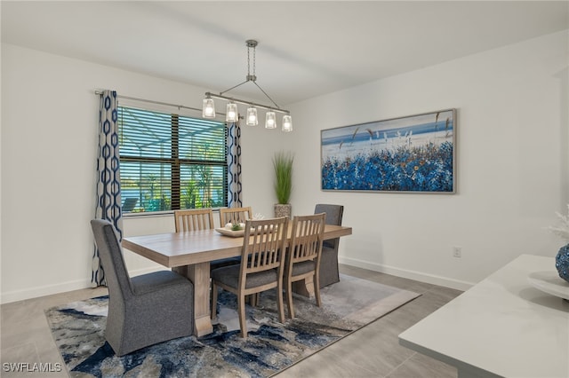 dining space with an inviting chandelier