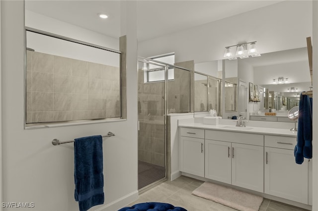 bathroom with tile patterned flooring, vanity, and an enclosed shower