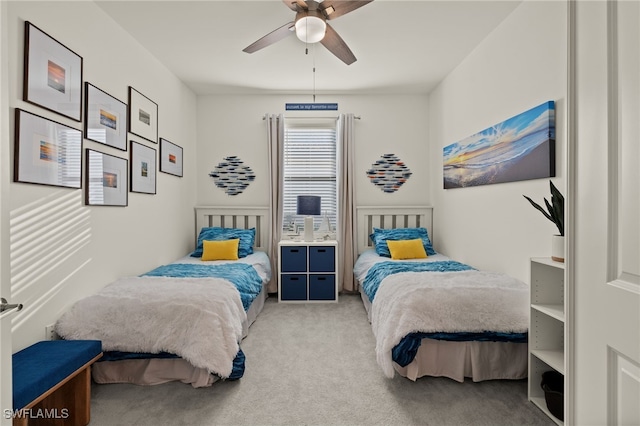 bedroom with light colored carpet and ceiling fan