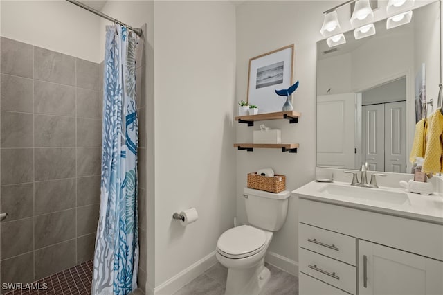 bathroom featuring tile patterned floors, vanity, curtained shower, and toilet