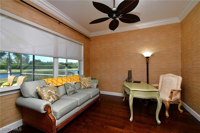 living room featuring ceiling fan, ornamental molding, and dark wood-type flooring