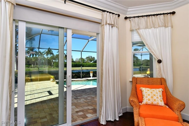 doorway to outside with dark hardwood / wood-style flooring, a water view, and ornamental molding