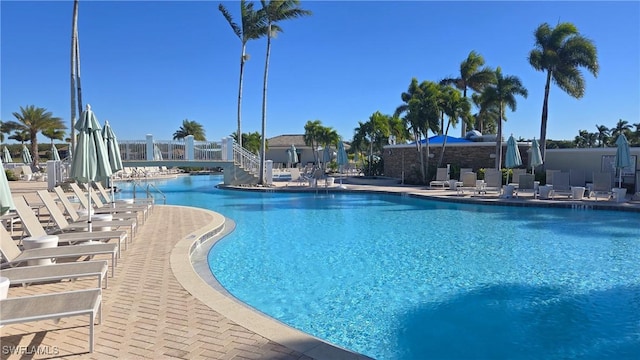 view of swimming pool with a patio area