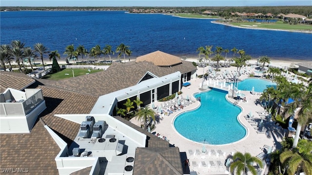 view of pool featuring a water view