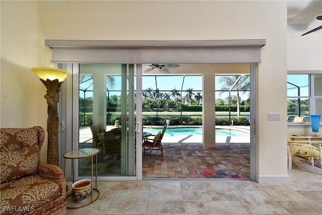 doorway featuring a wealth of natural light and ceiling fan