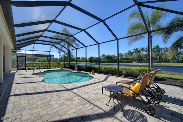 view of pool featuring glass enclosure and a patio area