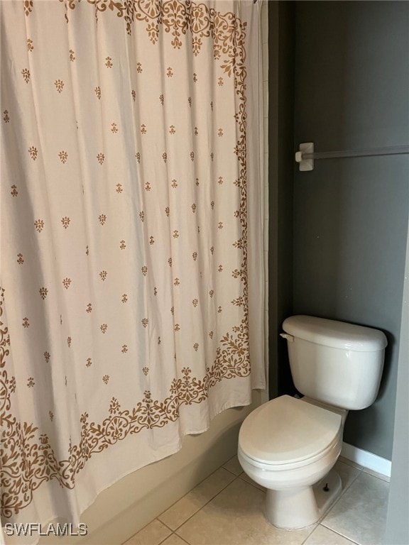 bathroom featuring tile patterned flooring and toilet