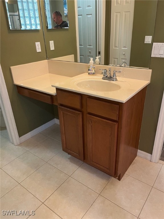 bathroom with tile patterned floors and vanity