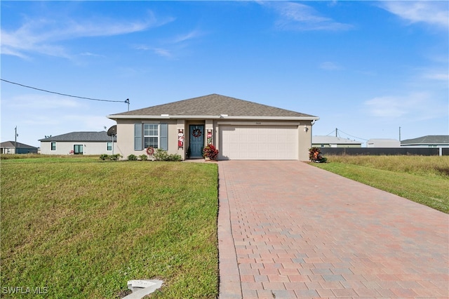 view of front of property with a front lawn and a garage