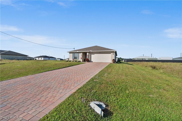 ranch-style house featuring a garage and a front lawn