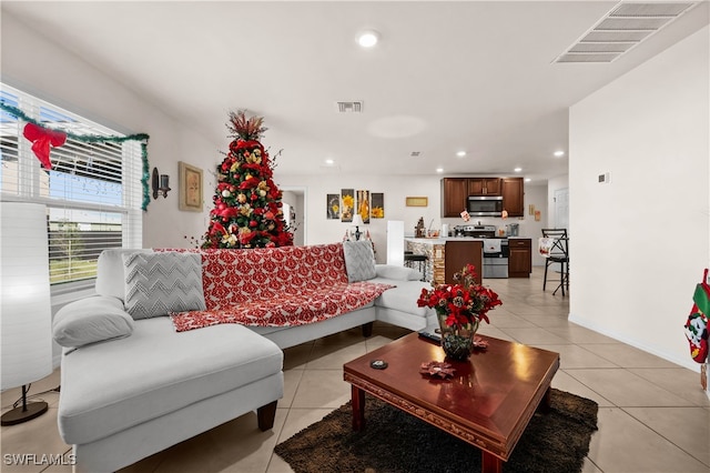 living room with light tile patterned floors