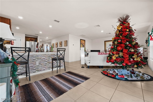 living room with light tile patterned flooring