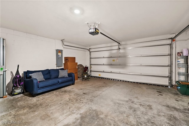 garage with electric panel and a garage door opener