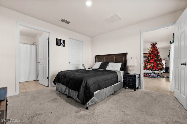 bedroom featuring light colored carpet