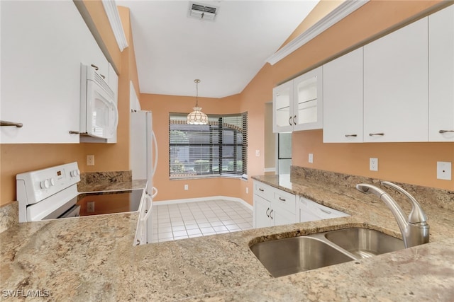 kitchen featuring light tile patterned floors, white cabinetry, white appliances, pendant lighting, and sink