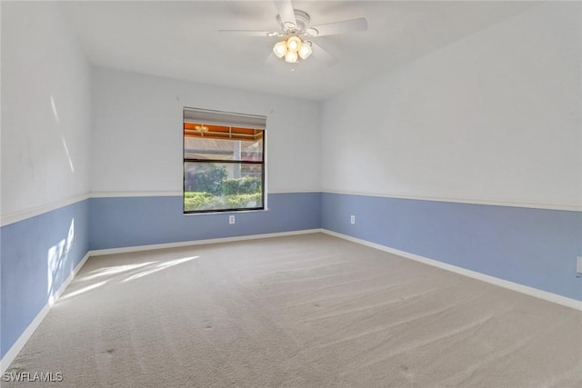 empty room featuring ceiling fan and carpet flooring