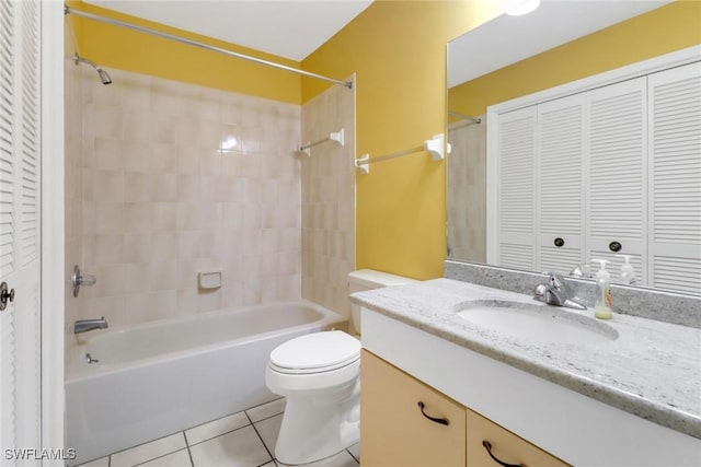 full bathroom featuring tile patterned floors, vanity, toilet, and shower / washtub combination