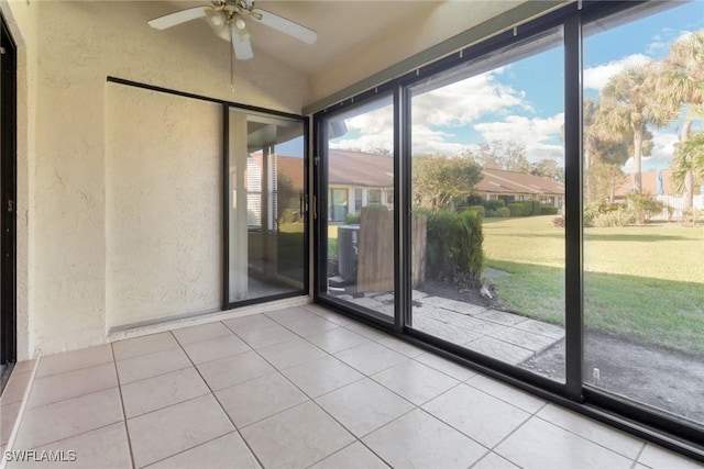 interior space with ceiling fan