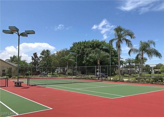 view of sport court with basketball hoop