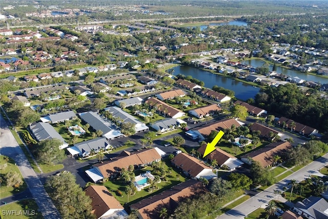 birds eye view of property featuring a water view