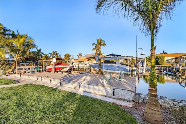 exterior space featuring a boat dock and a water view