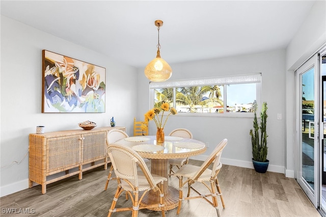 dining area with wood-type flooring