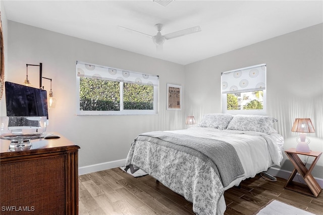 bedroom with ceiling fan and wood-type flooring