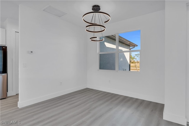 unfurnished dining area with light hardwood / wood-style floors