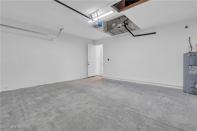 garage featuring electric water heater and a garage door opener