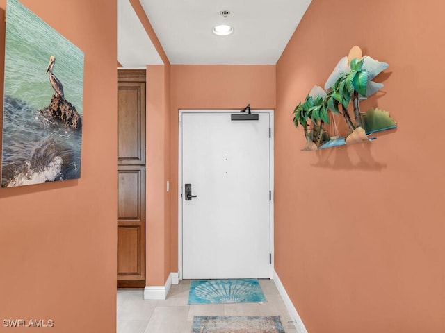 doorway to outside featuring light tile patterned floors