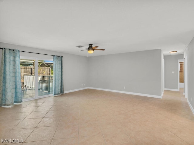 unfurnished room with ceiling fan and light tile patterned flooring