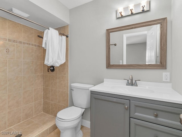 bathroom featuring a shower with curtain, vanity, toilet, and tile patterned floors