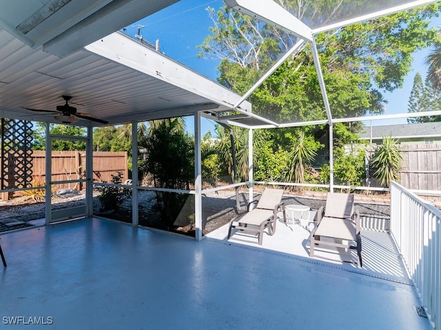 view of patio / terrace with glass enclosure and ceiling fan